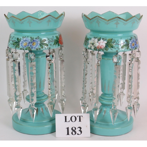 183 - A pair of late Victorian/Edwardian pale blue glass table lustre's hand decorated with a floral band ... 