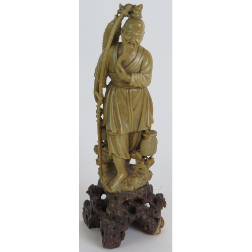 187 - Two Chinese hardwood root carvings of fisherman plus a similar Hardstone carving 25cm tall. (3). Con... 