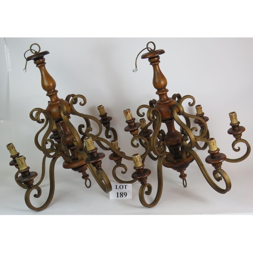 189 - Two gilt metal and wood six branch electric chandeliers, height 70cm. (2). Condition report: Vintage... 