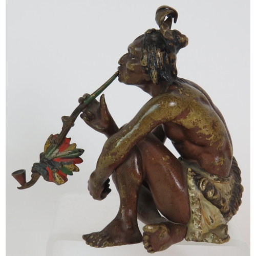 19 - A Franz Bergman cold painted bronze figure of a crouching native American Indian smoking a pipe, sta... 