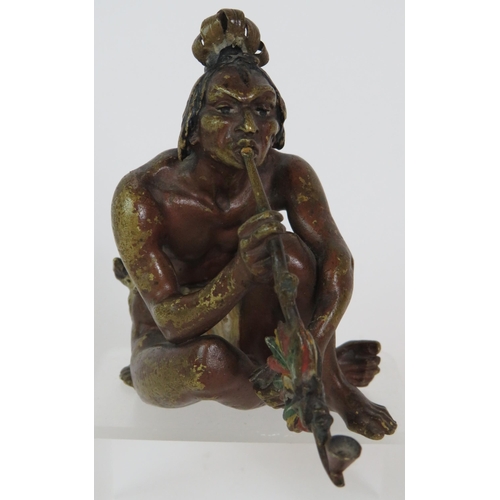 19 - A Franz Bergman cold painted bronze figure of a crouching native American Indian smoking a pipe, sta... 