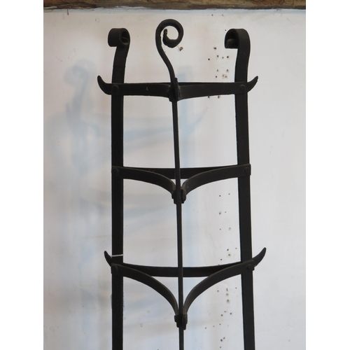 190 - Three vintage wrought iron kitchen pot/saucepan stands of triangular form. Tallest 184cm. (3). Condi... 