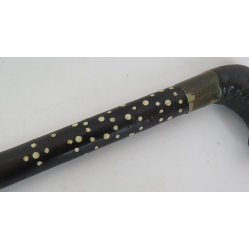 191 - An Asian bone inlaid ebony walking cane with leather covered handle and barley twist shaft. Length 8... 