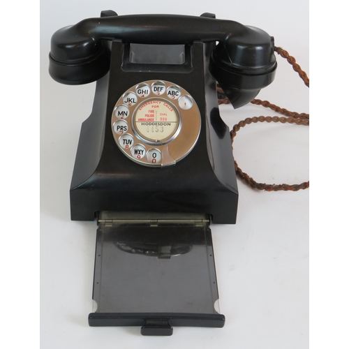 195 - A vintage black Bakelite telephone with drawer, dated internally February 1959, converted for BT use... 