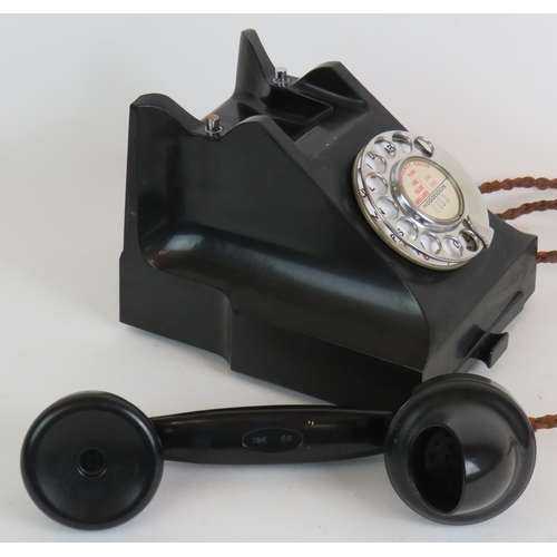 195 - A vintage black Bakelite telephone with drawer, dated internally February 1959, converted for BT use... 