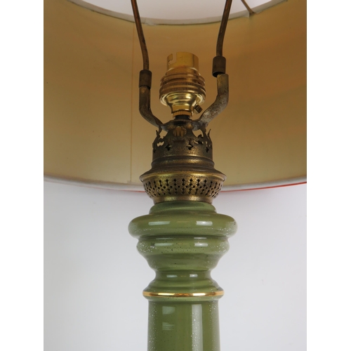 199 - A retro vintage green glass column table lamp with multicoloured ribbon shade. Overall height 72cm. ... 