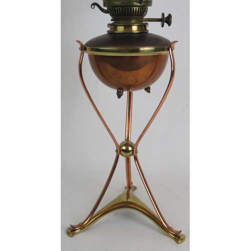 200 - An antique brass and copper Arts and Crafts oil lamp in the style of W.A.S. Benson with Messenger No... 