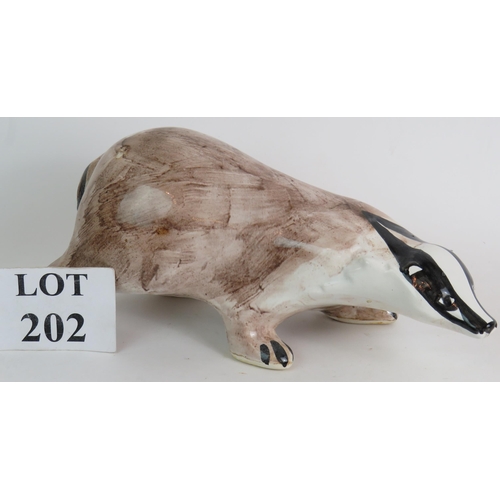 202 - A large Rye Pottery badger by David Sharp, 35cm long. 
Condition report: Firing crack to front leg.
... 