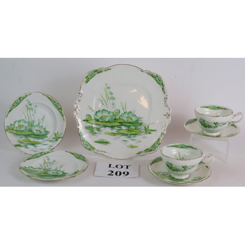 209 - A seven piece Royal Paragon Water Lily tea set hand decorated in green. (7).
Condition report: No is... 