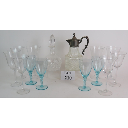 210 - A good quality cut crystal decanter, a white metal mounted claret jug, four blue wine glasses and ei... 