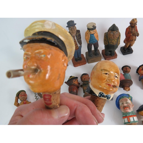 211 - A collection of mainly Black Forest style carved wood figures and bottle stoppers including automate... 