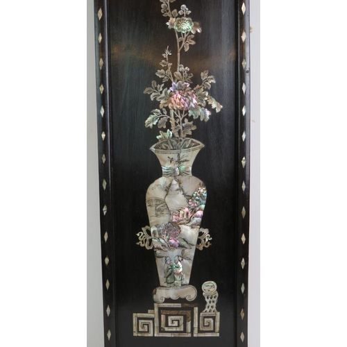 214 - A decorative Chinese inlaid rosewood panel with mother of pearl inlay depicting a traditional vase a... 