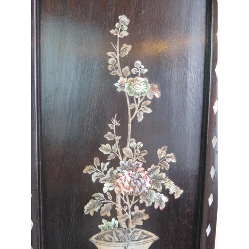 214 - A decorative Chinese inlaid rosewood panel with mother of pearl inlay depicting a traditional vase a... 