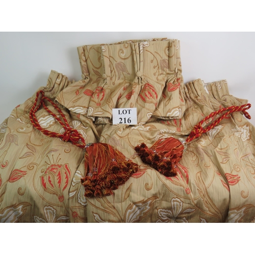 216 - Two large pairs of high quality lined curtains in gold and red tulip pattern, with two tiebacks and ... 