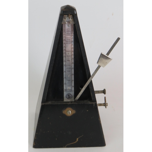 218 - A black Japanned Maelzel metronome with bell, dated 1965. Height 22cm.
Condition report: Feet missin... 