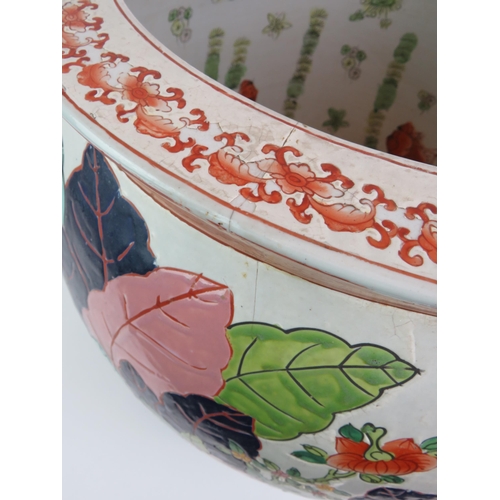 22 - A very large Chinese porcelain fish bowl, internally decorated with goldfish and externally with flo... 