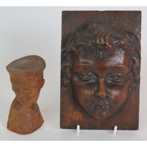 226 - An antique brass bound oak box, a 19th Century carved oak cherub mask and a WW2 carved oak bust of a... 