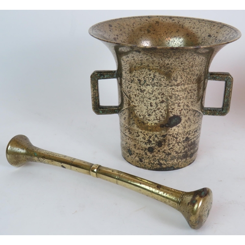 228 - A heavy brass antique pestle and mortar, a squat brass and copper pot and a brass tea caddy. Mortar ... 