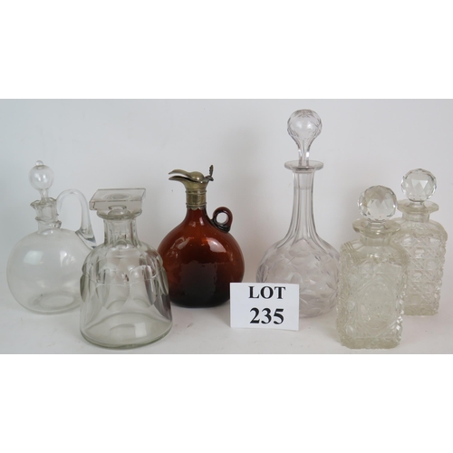 235 - Six antique decanters including a brown glass jug with white metal mount and two hobnail cut square ... 