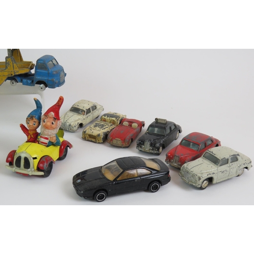 27 - A collection of mainly Corgi and Dinky toy cars including two transporters, a hovercraft and Noddy c... 