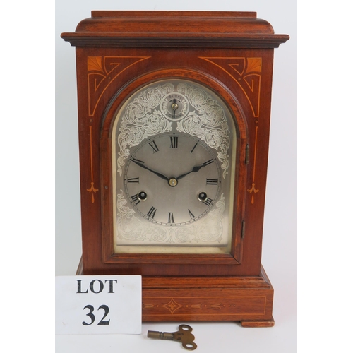 32 - An early 20th Century inlaid walnut mantel chiming clock of German manufacture, movement stamped 155... 