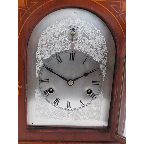 32 - An early 20th Century inlaid walnut mantel chiming clock of German manufacture, movement stamped 155... 