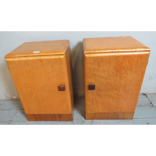 708 - A pair of Art Deco birds eye maple bedside cabinets with chamfered square wooden handles, with fitte... 