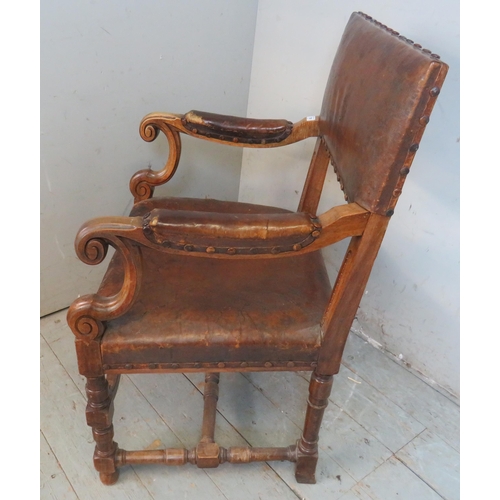 709 - A 19th century Dutch mahogany framed open sided armchair upholstered in the original deeply patinate... 