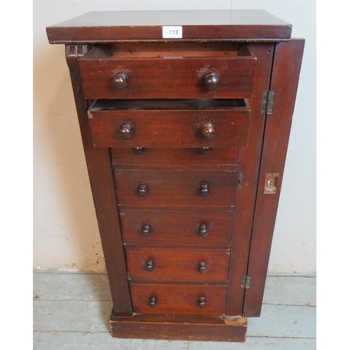 713 - A 19th century Wellington chest of seven graduated short drawers each with twin turned wooden knob h... 