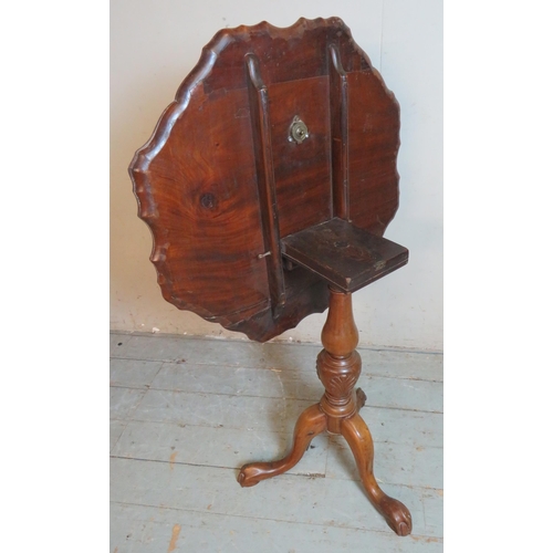 714 - A 19th century mahogany tilt top table with pie crust edge carved with acanthus leaves, raised on a ... 