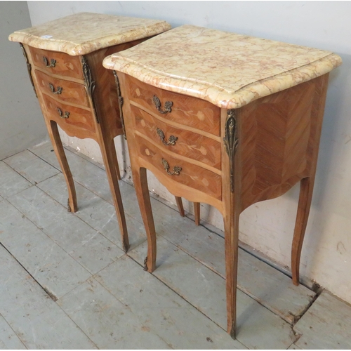 716 - A pair of vintage French gilt metal mounted tulip wood bedside cabinets, topped with striated cream ... 