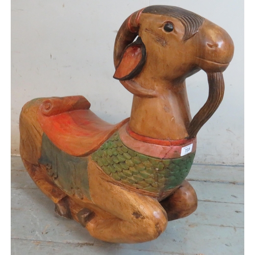 723 - A hardwood carved & painted 'rocking goat'.
65cm high x 78cm wide x 20cm deep (approx)
Estimated: £4... 