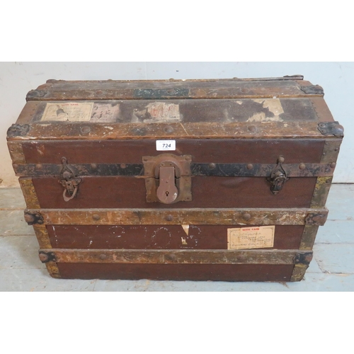 724 - A 19th century dome topped leather, wood & metal band travelling trunk, bearing various numerous his... 