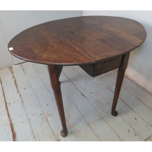 725 - An 18th century oak oval drop leaf table, raised on tapering supports with pad feet.
Estimated: £40-... 