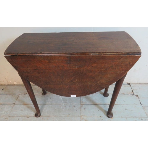 725 - An 18th century oak oval drop leaf table, raised on tapering supports with pad feet.
Estimated: £40-... 