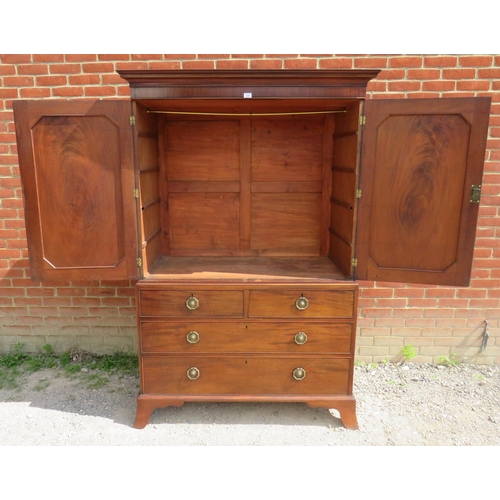 729 - A Georgian mahogany linen press with parquetry inlaid cornice over a two double doors opening onto h... 