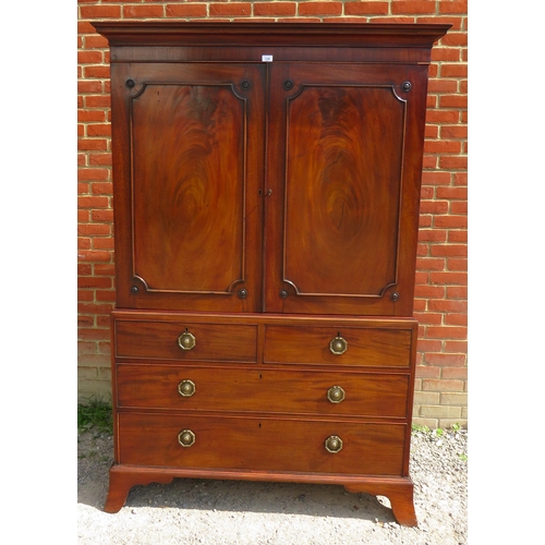 729 - A Georgian mahogany linen press with parquetry inlaid cornice over a two double doors opening onto h... 