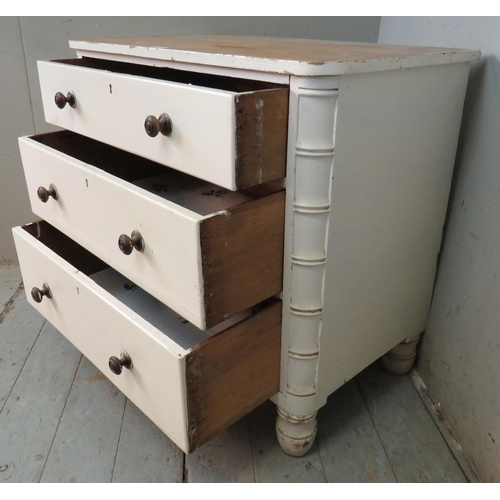 733 - A 19th century painted pine chest of three long drawers with turned wooden knob handles, raised on t... 