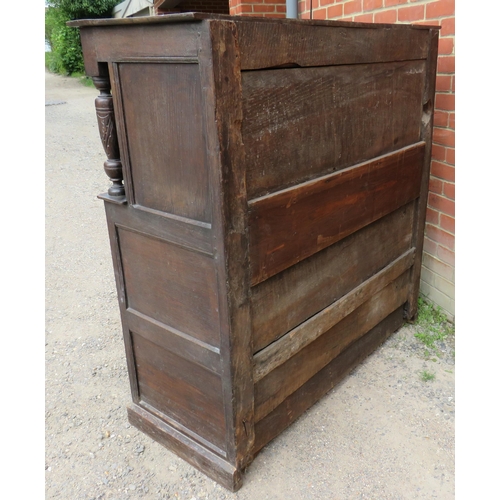 736 - An 18th century oak court cupboard of small proportions with carved frieze over two cupboard doors o... 