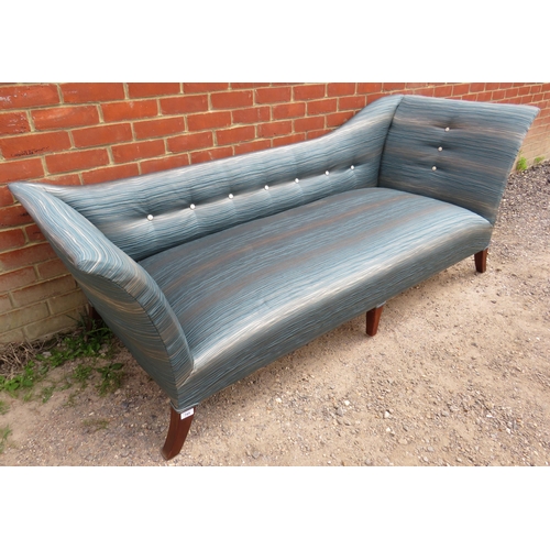 745 - A large chaise longue upholstered in blue & silver contemporary material, raised on out swept mahoga... 