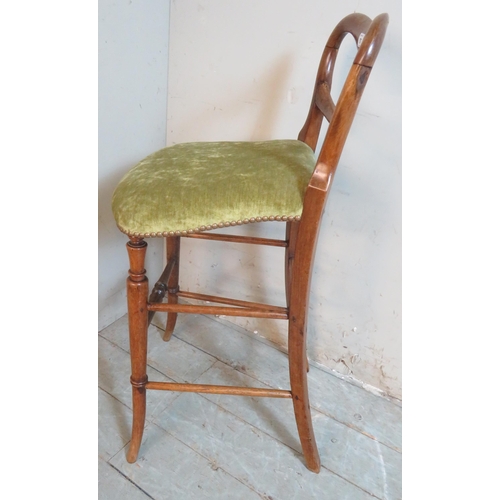 757 - A Victorian rosewood cellist's stool with a low back over a downward sloping seat, upholstered in pi... 