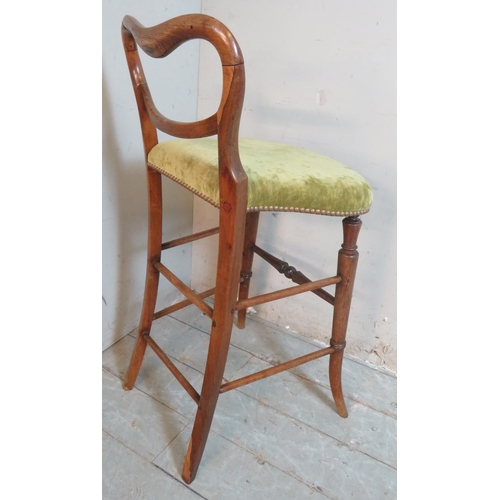 757 - A Victorian rosewood cellist's stool with a low back over a downward sloping seat, upholstered in pi... 