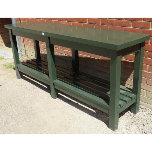 759 - An antique dairy table of very solid construction, raised on square supports united by a latted pot ... 