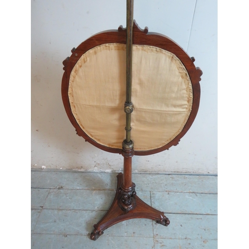 761 - A Victorian rosewood pole screen with a tapestry & wool work panel depicting exotic birds, raised on... 