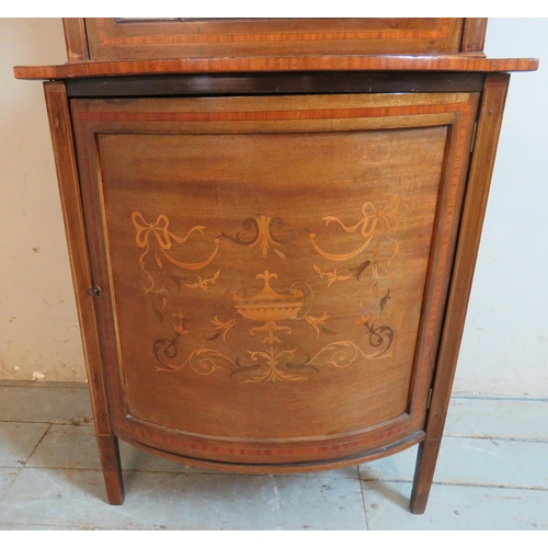 763 - An Edwardian Regency revival inlaid & crossbanded display cabinet with marquetry cornice over an ast... 