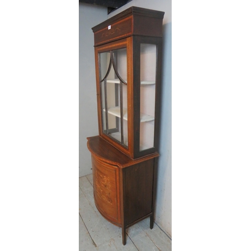 763 - An Edwardian Regency revival inlaid & crossbanded display cabinet with marquetry cornice over an ast... 