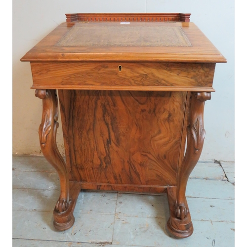 764 - A late Victorian rosewood Davenport with dentil moulded gallery and inset brown leather gilt tooled ... 