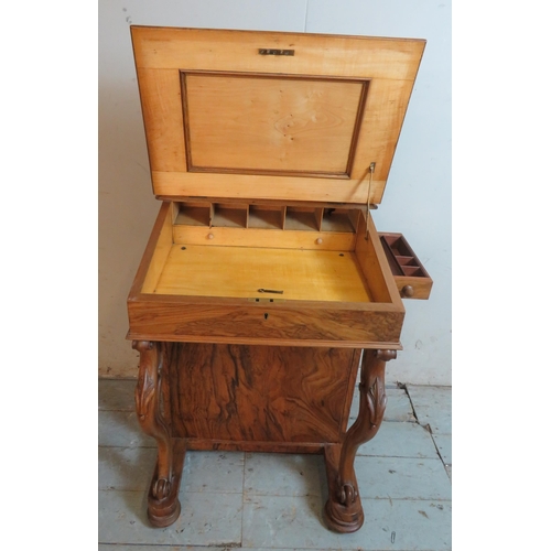 764 - A late Victorian rosewood Davenport with dentil moulded gallery and inset brown leather gilt tooled ... 