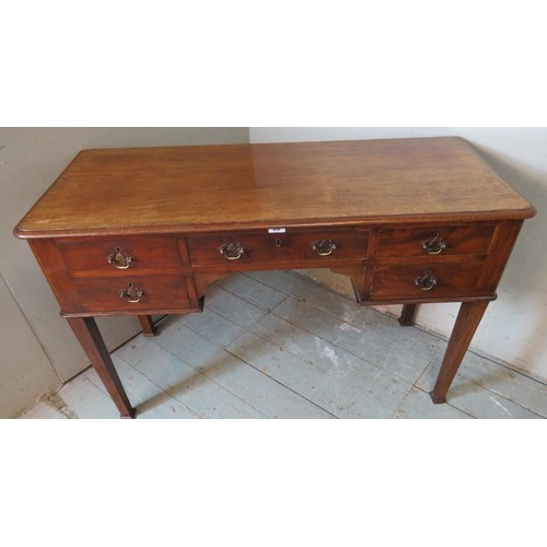 768 - A 19th century mahogany writing desk containing an array of five drawers with brass back handles & b... 