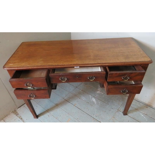 768 - A 19th century mahogany writing desk containing an array of five drawers with brass back handles & b... 